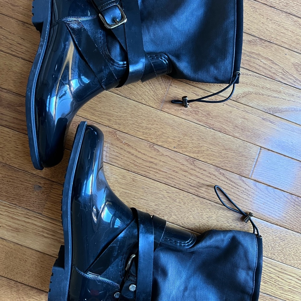 Stuart Weitzman black shiny rain boots. Well lined to keep you warm and dry